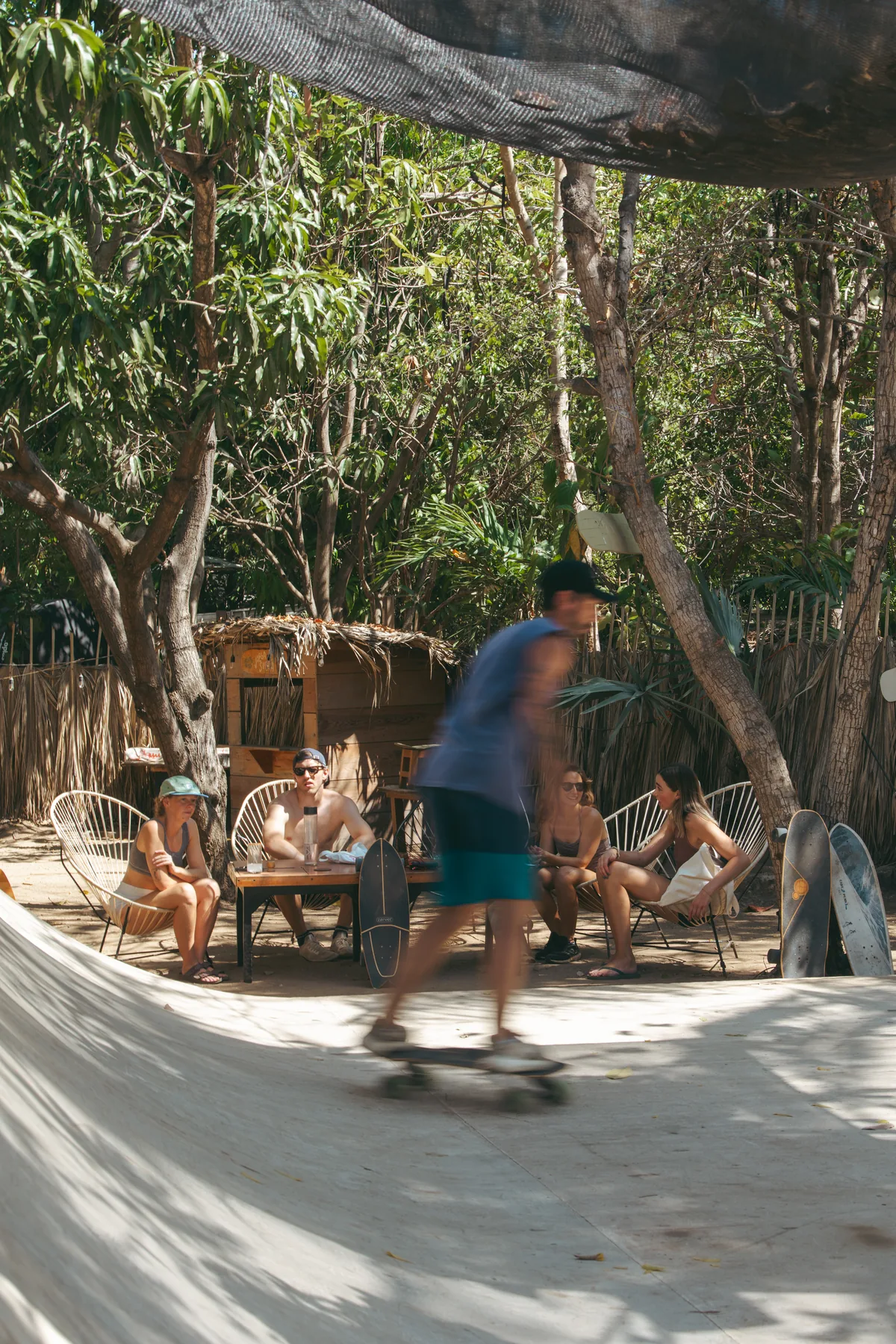 Guests hanging out and skating at a local skate spot in town near La Punta, Puerto Escondido